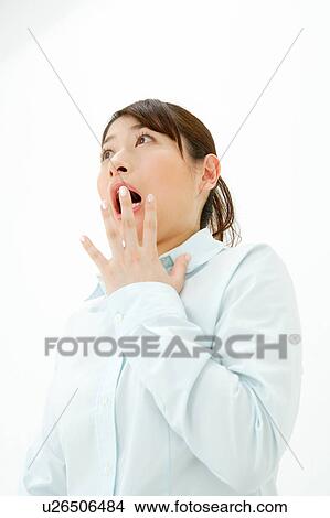 Picture - Young woman gasping. Fotosearch