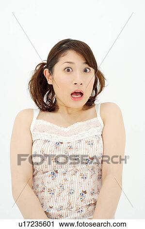 Stock Image - Young woman gasping. Fotosearch