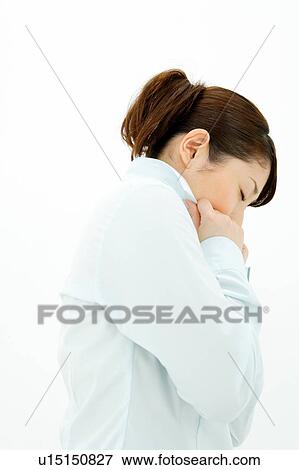 Young woman holding her collar View Large Photo Image Stock Photo - Young woman holding her collar. Fotosearch