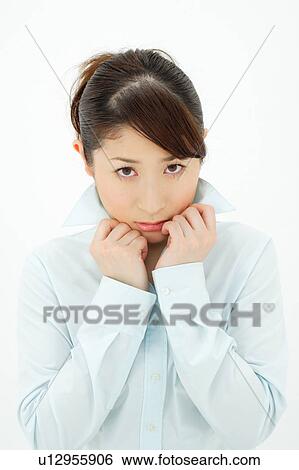 Young woman holding her collar View Large Photo Image Stock Photograph - Young woman holding her collar. Fotosearch
