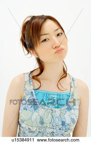 Young woman looking annoyed View Large Photo Image Stock Image - Young woman looking annoyed. Fotosearch