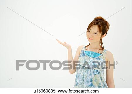 Stock Photography - Young woman looking at camera. Fotosearch