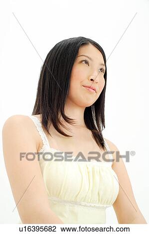 Stock Image - Young woman looking away. Fotosearch