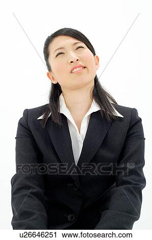 Young woman looking up View Large Photo Image Stock Image - Young woman looking up. Fotosearch