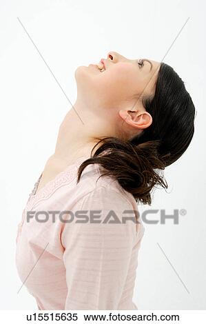 Stock Photography - Young woman looking up. Fotosearch