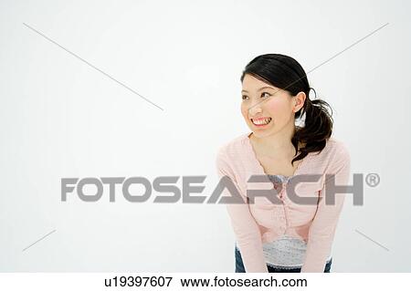Stock Photo - Young woman smiling. Fotosearch