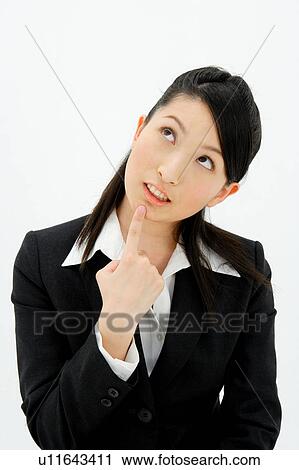 Stock Image - Young woman thinking. Fotosearch