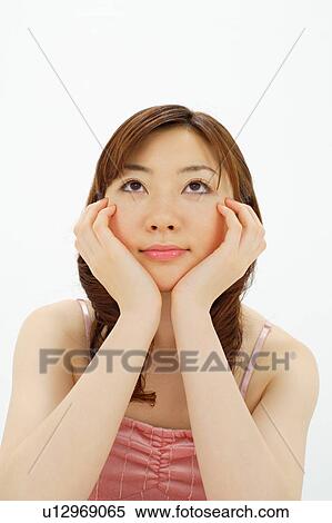 Stock Photography - Young woman thinking. Fotosearch