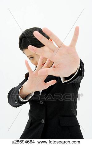 Picture - Young woman with her arm outstretched. Fotosearch