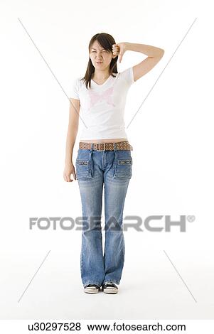 Stock Photo - Young woman giving thumbs down. Fotosearch