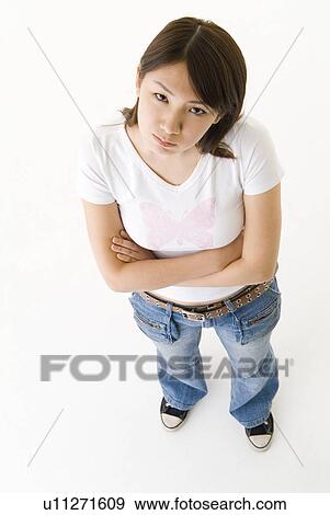 Stock Photo - Young woman looking annoyed. Fotosearch