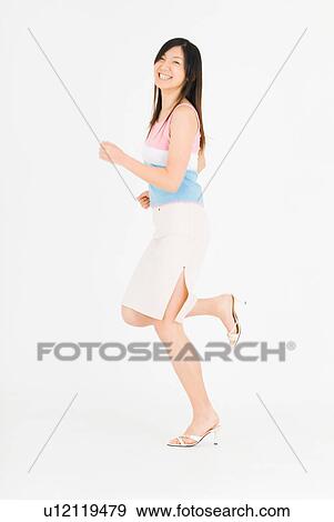 Stock Photo - Young woman running. Fotosearch