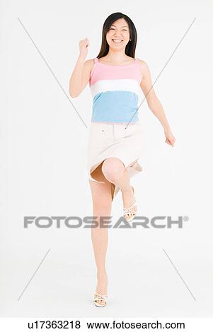 Young woman running View Large Photo Image Stock Photo - Young woman running. Fotosearch