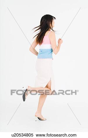 Young woman running View Large Photo Image Stock Photography - Young woman running. Fotosearch