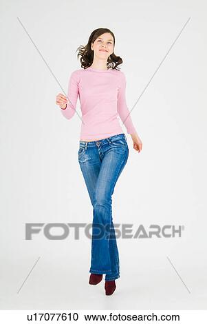 Young woman skipping View Large Photo Image Stock Image - Young woman skipping. Fotosearch