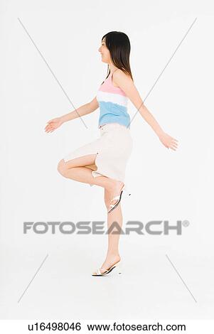 Young woman skipping View Large Photo Image Stock Photograph - Young woman skipping. Fotosearch