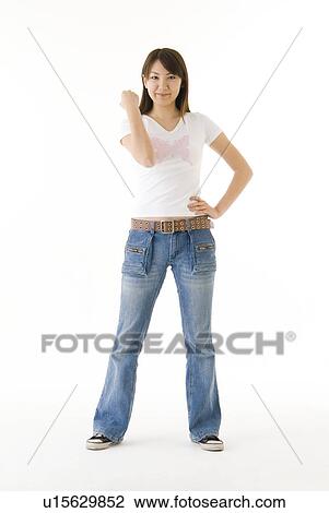 Stock Image - Young woman standing. Fotosearch