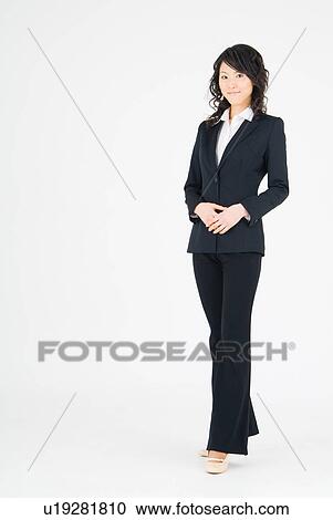 Young woman standing View Large Photo Image Stock Image - Young woman standing. Fotosearch