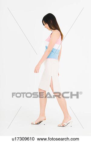 Young woman walking View Large Photo Image Stock Image - Young woman walking . Fotosearch