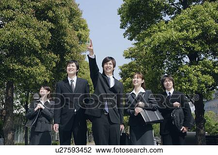Stock Image - Five young businessperson smiling. Fotosearch