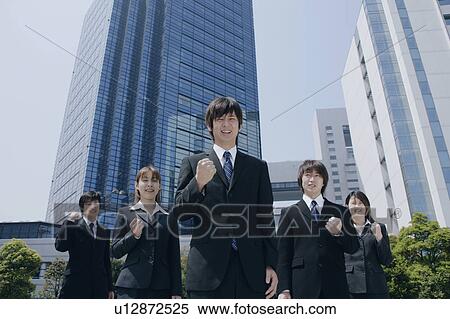 Stock Photography - Five young businessperson smiling. Fotosearch