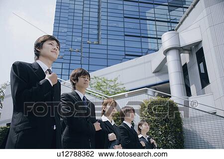 Stock Image - Five young businessperson standing. Fotosearch