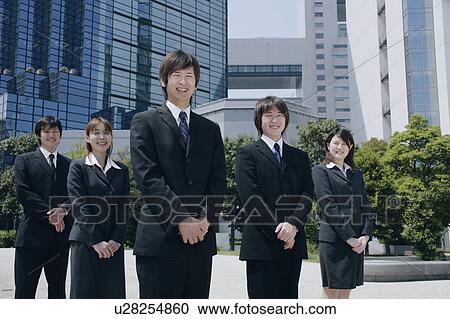 Stock Image - Five young businessperson standing. Fotosearch