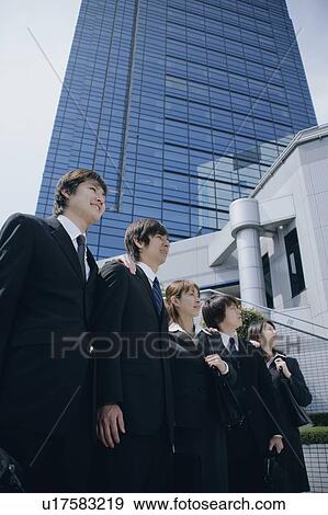 Stock Photo - Five young businessperson standing. Fotosearch