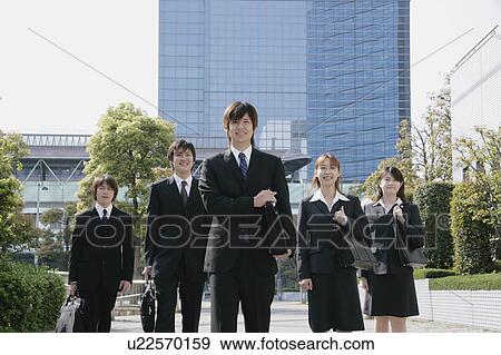 Stock Photo - Five young businessperson standing. Fotosearch