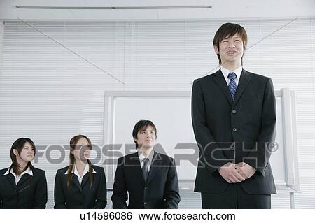 Stock Photograph - Four young people having job interview. Fotosearch