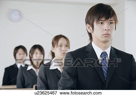 Four young people sitting in a meeting room View Large Photo Image Stock Photo - Four young people sitting in a meeting room. Fotosearch