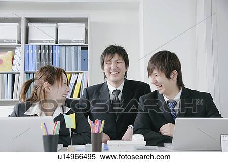 Three young businessperson working View Large Photo Image Stock Photography - Three young businessperson working. Fotosearch