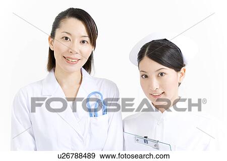 A female doctor and a female nurse View Large Photo Image Stock Photo - A female doctor and a female nurse. Fotosearch