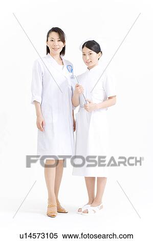 Stock Photography - A female doctor and a female nurse. Fotosearch