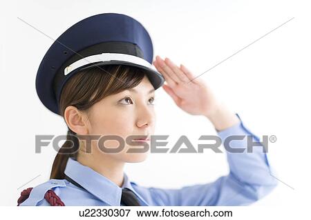 A female security guard saluting View Large Photo Image Stock Photo - A female security guard saluting. Fotosearch