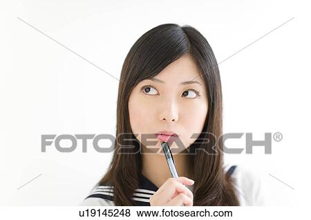 A high school girl thinking View Large Photo Image Stock Photo - A high school girl thinking. Fotosearch