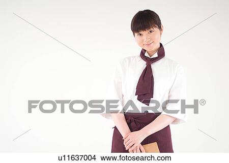 Picture - A waitress smiling. Fotosearch
