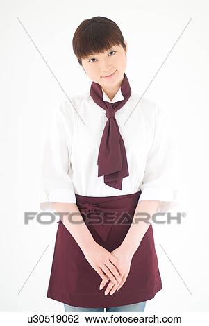 Stock Image - A waitress smiling. Fotosearch