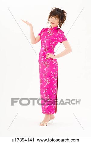 Stock Image - A young woman in Chinese dress smiling. Fotosearch