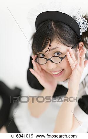 A young woman in French maid outfit smiling View Large Photo Image Stock Photo - A young woman in French maid outfit smiling. Fotosearch
