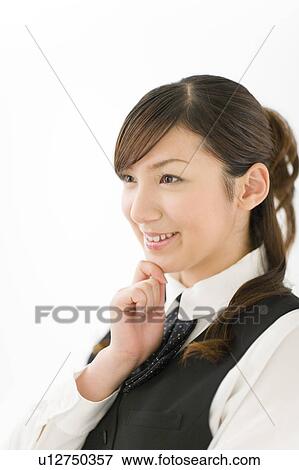 Stock Photo - A young woman in uniform smiling. Fotosearch