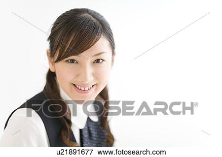 Stock Photo - A young woman in uniform smiling. Fotosearch