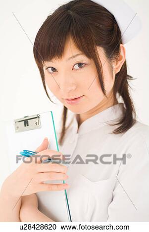 Nurse holding a clipboard View Large Photo Image Stock Image - Nurse holding a clipboard. Fotosearch