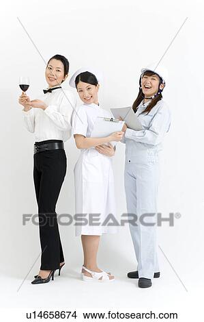 Picture - Three young women in professional uniform. Fotosearch