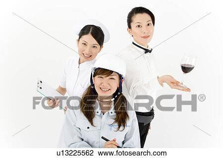 Stock Image - Three young women in professional uniform. Fotosearch