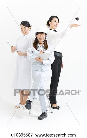 Stock Photo - Three young women in professional uniform. Fotosearch