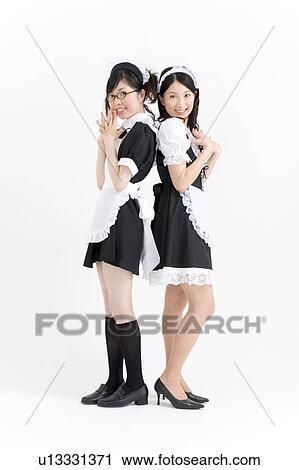 Two young women in French maid outfit smiling View Large Photo Image Stock Image - Two young women in French maid outfit smiling. Fotosearch