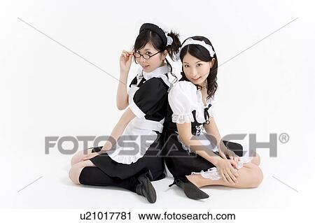 Two young women in French maid outfit smiling View Large Photo Image Stock Image - Two young women in French maid outfit smiling. Fotosearch