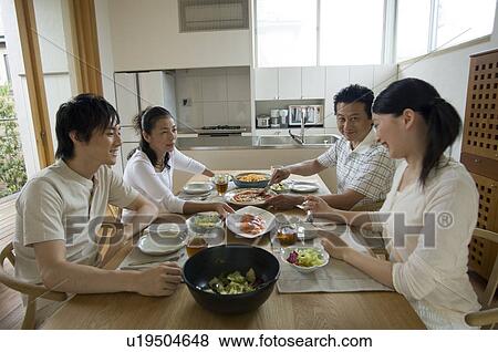 Family eating lunch at home View Large Photo Image Stock Photo - Family eating lunch at home. Fotosearch