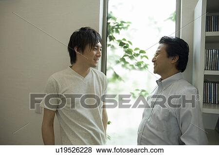 Father and son talking View Large Photo Image Stock Photo - Father and son talking. Fotosearch